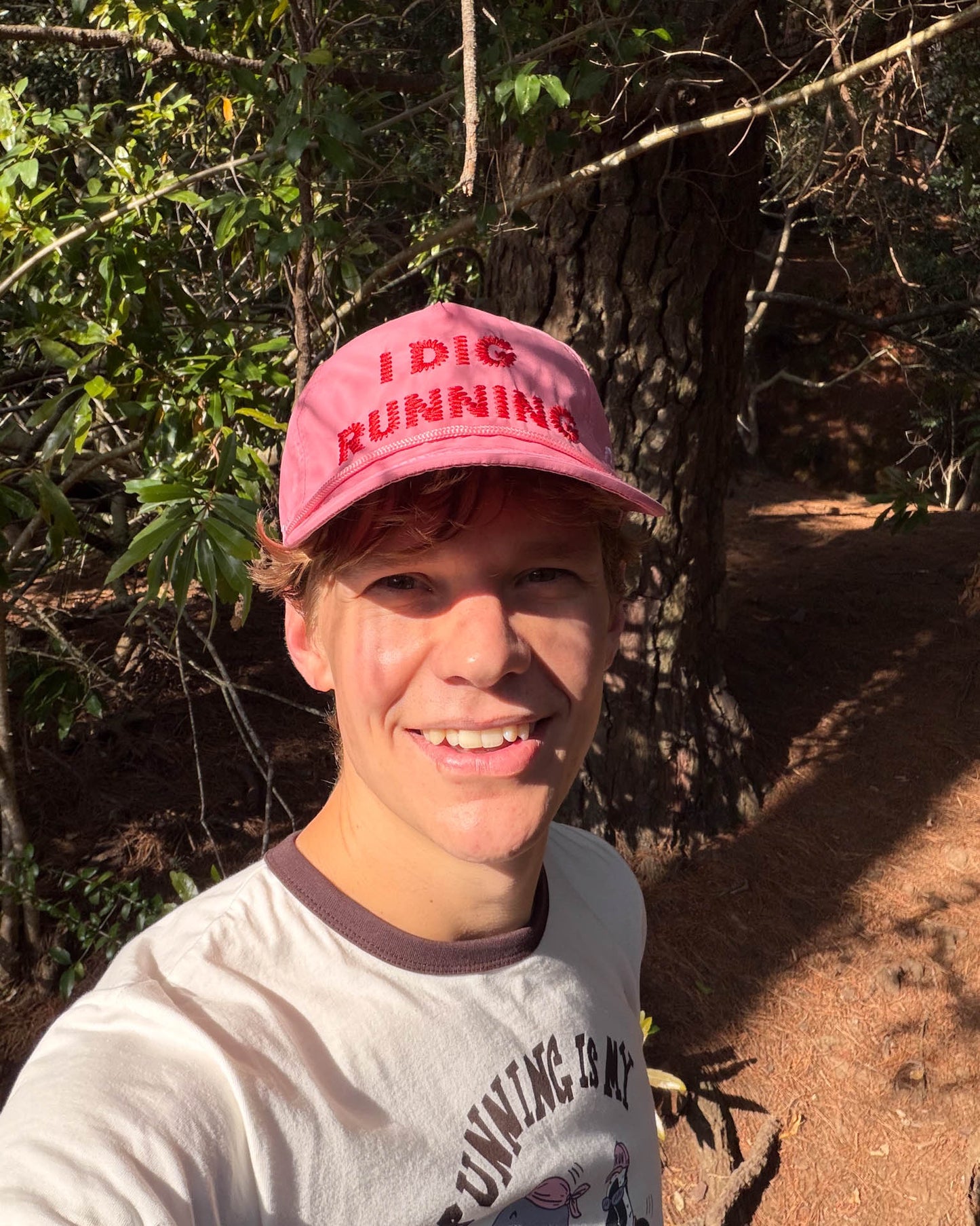 "I Dig Running" Pink Trucker